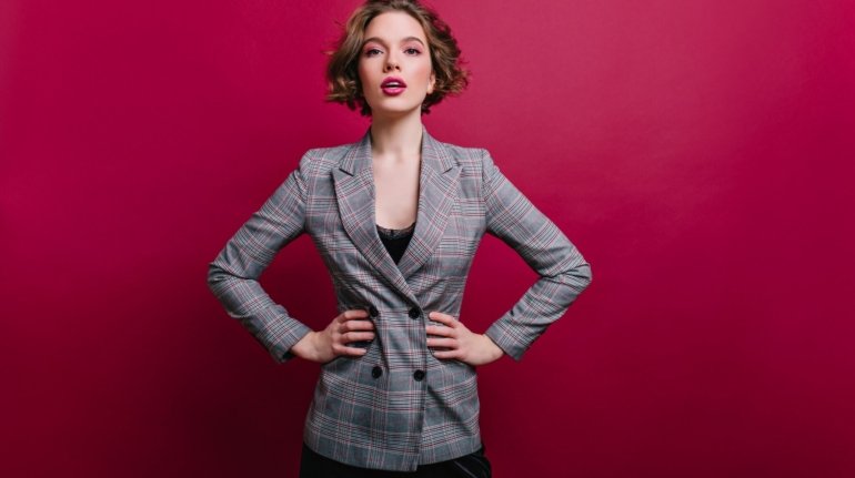 winsome-business-lady-with-short-haircut-posing-photo-confident-girl-tweed-jacket-isolated-claret-wall_197531-8071